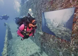 Diver inspects an underwater art gallery on the Vandenberg in Key West
