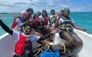 BIP Week participants after completing a dive  .png.webp