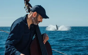 GarthStevensonPlayingWithHumpbackWhales_AndyMann.jpg.webp