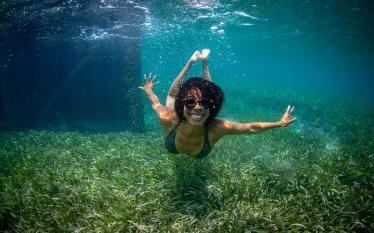 ayana-johnson-swimming-seagrass-credit-jeremy-mckane.jpg.webp