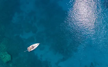boat-on-ocean-aerial-shutterstock-vladimir-hodac.jpg.webp