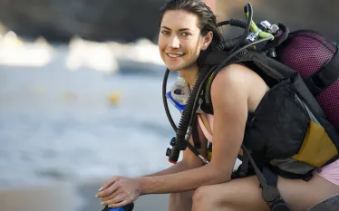 female-diver-topside-no-wetsuit-shutterstock-air-images.png.webp