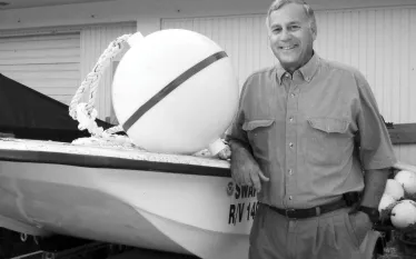 halas-with-buoy-courtesy-noaa-archives.jpg.webp