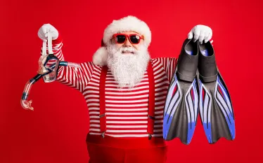 santa-holding-dive-mask-fins-credit-shutterstock-roman-samborskyi.png.webp