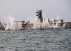 Rail car being purpose-sunk