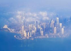Doha from the plane as it appears to travelers in a foggy morning.