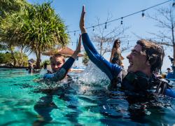 Scuba Divers High Five
