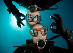Divers Underwater Giving OK signals