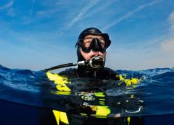 Scuba Diver Alone at Surface Left By Boat