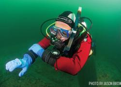 diver navigating with underwater compass