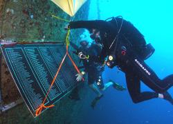 divers install plaque on the Spiegel Grove