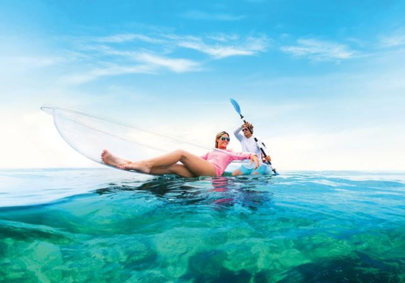 A person and person in a kayak